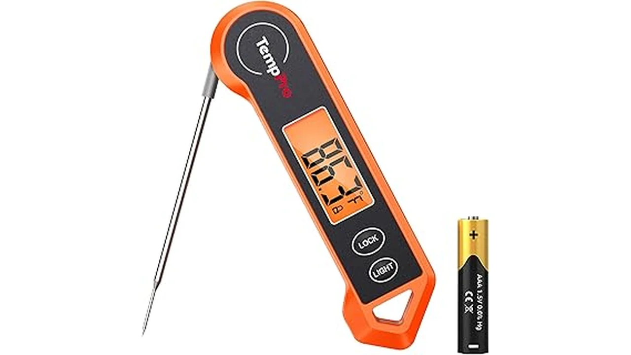 The image shows a person using a sleek electric meat thermometer to check the temperature of a roasted chicken.